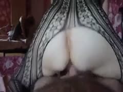 In reverse cowgirl stance, my girlfriend covers my knob with a lacy, crotchless bodysuit.